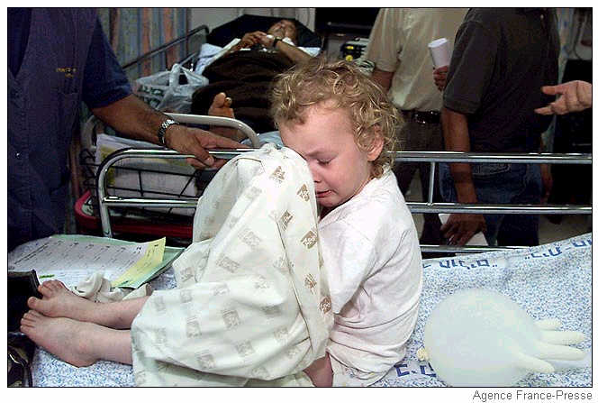 A wounded Israeli baby cries at a Jerusalem hospital.