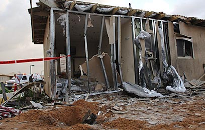 A baby was seriously injured when a Palestinian Qassam rocket struck this house in southern Israel. (Photo: Amir Cohen, for YNET News)