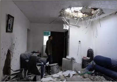 Damage to an apartment after a Palestinian rocket struck the coastal city of Ashkelon. (Reuters, February 28)