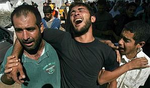 Relatives mourn during funeral procession in Beit Hanoun (AP).